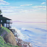 A coastal landscape painting showing a dark house on a grassy cliff overlooking blue ocean waves with white surf, under a pale sky with soft clouds.